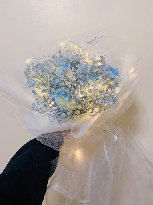 Ice blue rose with blue baby’s breath